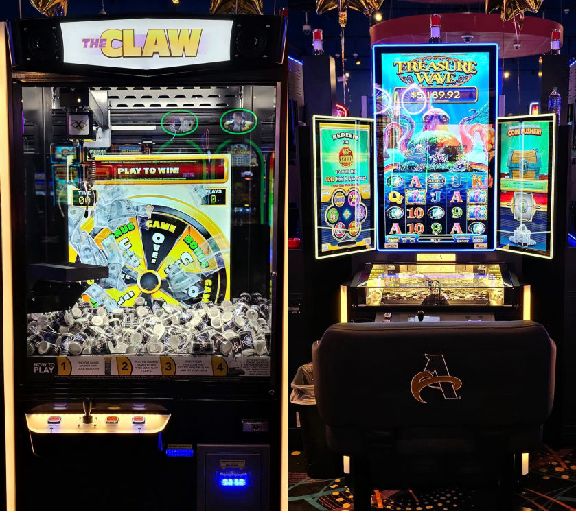 A photo showing two gaming machines at High Winds Casino. On the left is a "Claw" machine with a spinning wheel and plastic coins, while on the right is a "Treasure Waves" slot machine displaying a jackpot of $5,189.92. The vibrant lighting and colorful designs illuminate the machines.